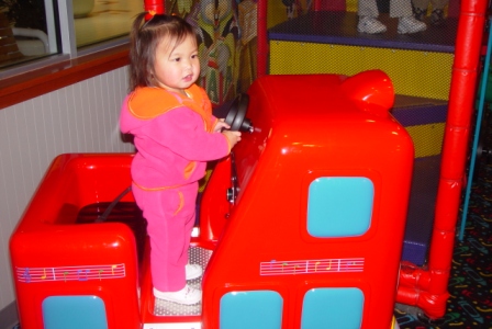 Kasen loving the rides at Chuck E. Cheese's